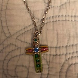 Cross necklace stones are in green, red and blue